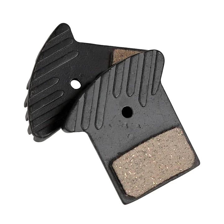 A Set of Nutt Hydraulic brake pads with cooling fins.