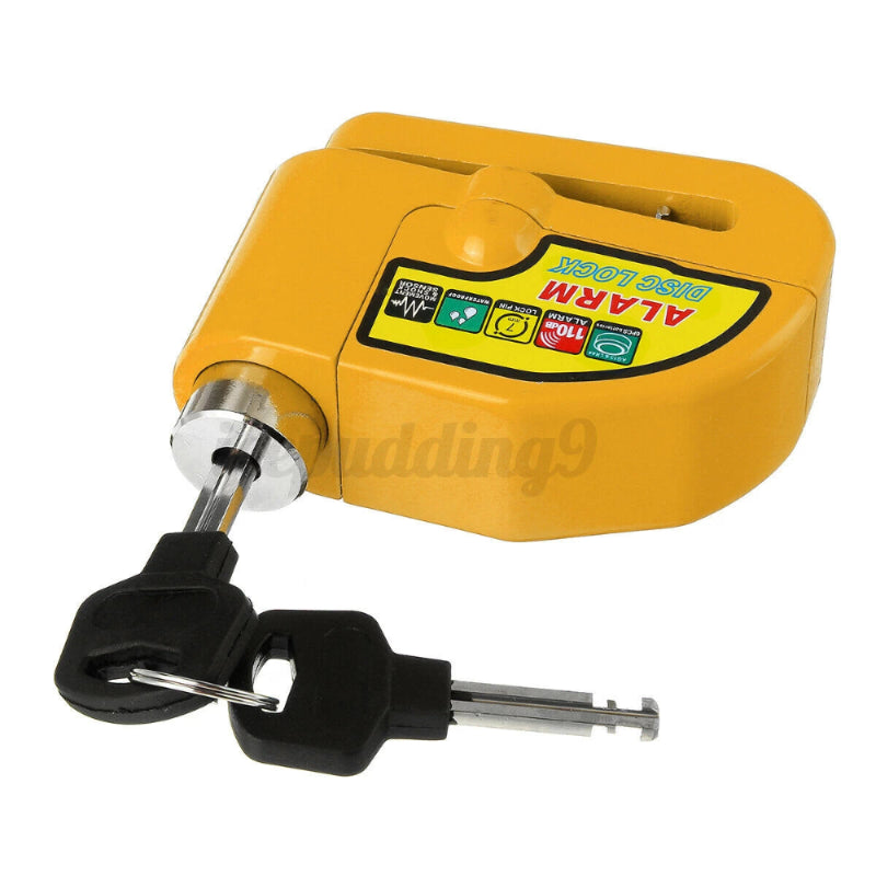 Side view of Yellow Disc Brake Lock Alarm with keys inserted, showing keyhole and pin mechanism.