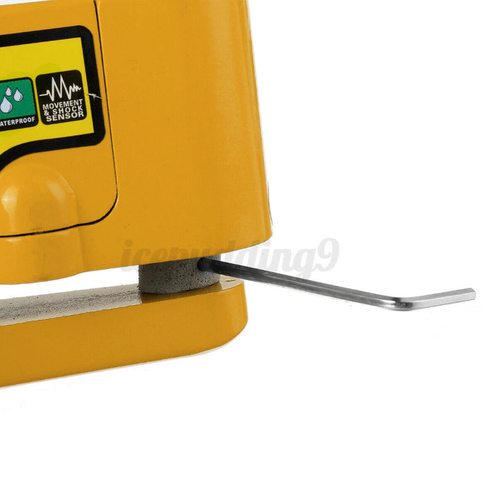 Spacer and hex key inside the Yellow Disc Brake Alarm Lock.