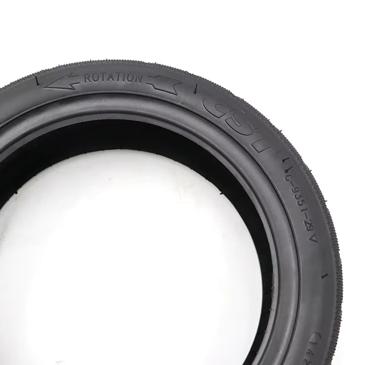 Side view showing the CST Branding and rotational direction arrow, to ensure fitted with the correct orientation.