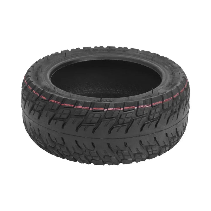 Flat lay view of tubeless 90/55-7 scooter tyre with visible shoulder lug pattern