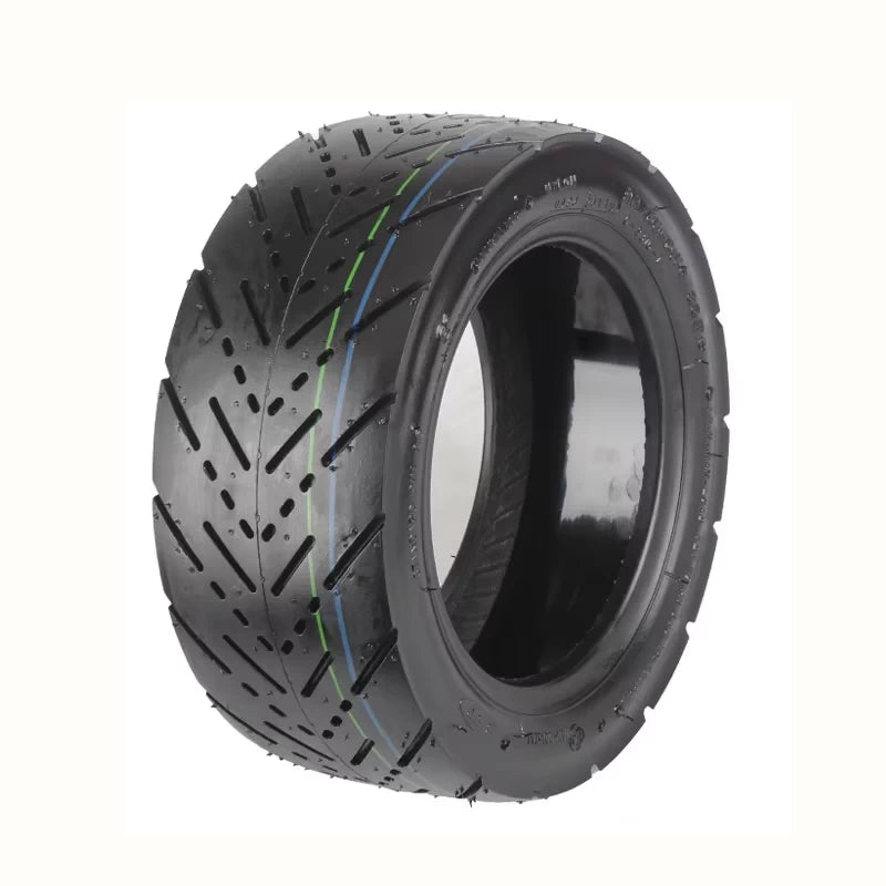 Hero view of CST self-healing 11 inch tubeless electric scooter tyre highlighting internal self-sealing gel layer and outer sidewall markings.