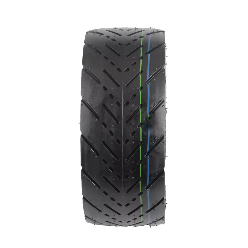 Direct tread view of CST 90/65-6.5 tyre showing precision chevron road grip pattern and coloured centre stripes for alignment and style.