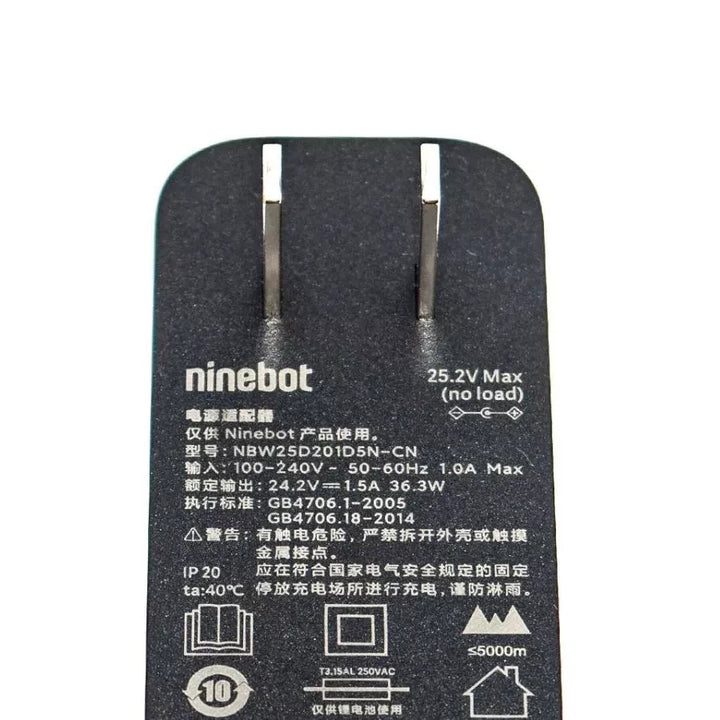 Close-up of charger label detailing input/output specs and safety certifications – Ninebot E2/E2 Plus charger