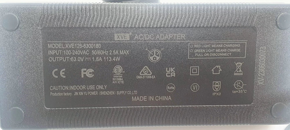 Detailed close-up of specifications panel of Charger (63V 1.8A)/AC Power Adapter for Inmotion/Dualtron - provides important information on voltage, current output, and manufacturer details for customer reference.