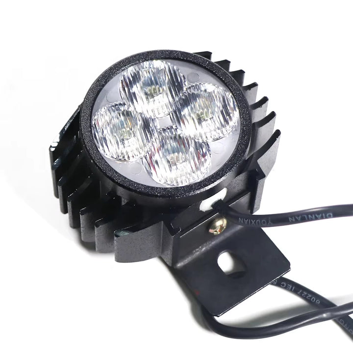 Downward angle of Kugoo G2 Pro 4-LED headlight showing glass lens and black alloy housing