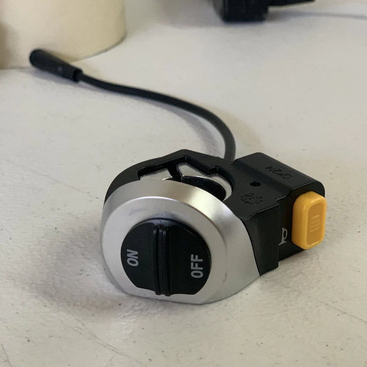 Side view of the EMOVE Touring light and horn switch module with waterproof connector and ergonomic buttons.