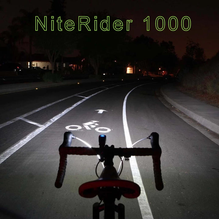 Road lit by NiteRider Lumina 1000 Boost headlight at night, showing clear visibility and focused light.
