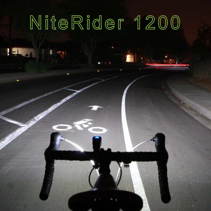 Brightly illuminated road at night using NiteRider Lumina 1200 Boost headlight with wide beam spread.