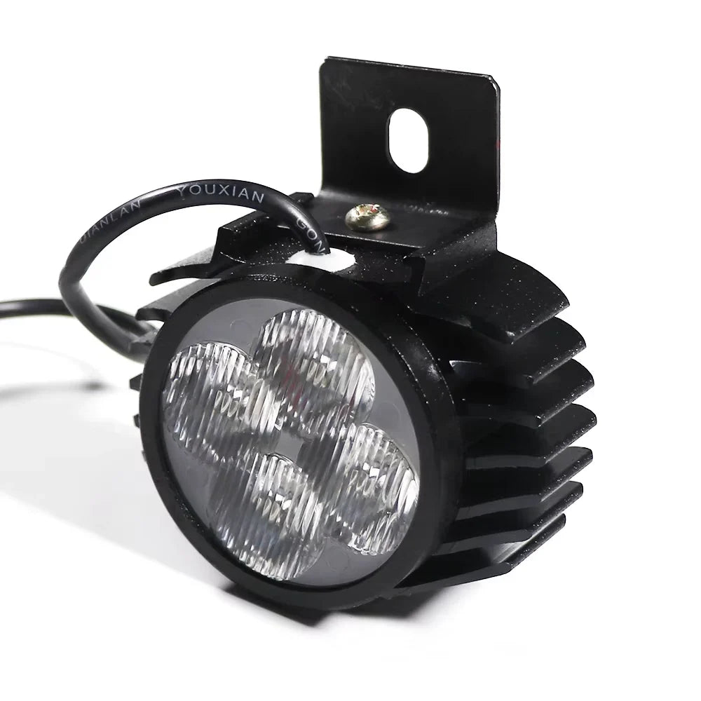 Angled view of Kugoo G2 Pro electric scooter headlight with rugged aluminium heatsink design