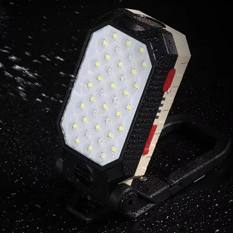 Waterproof work light under heavy water splashes, rated IPX6 for durability.