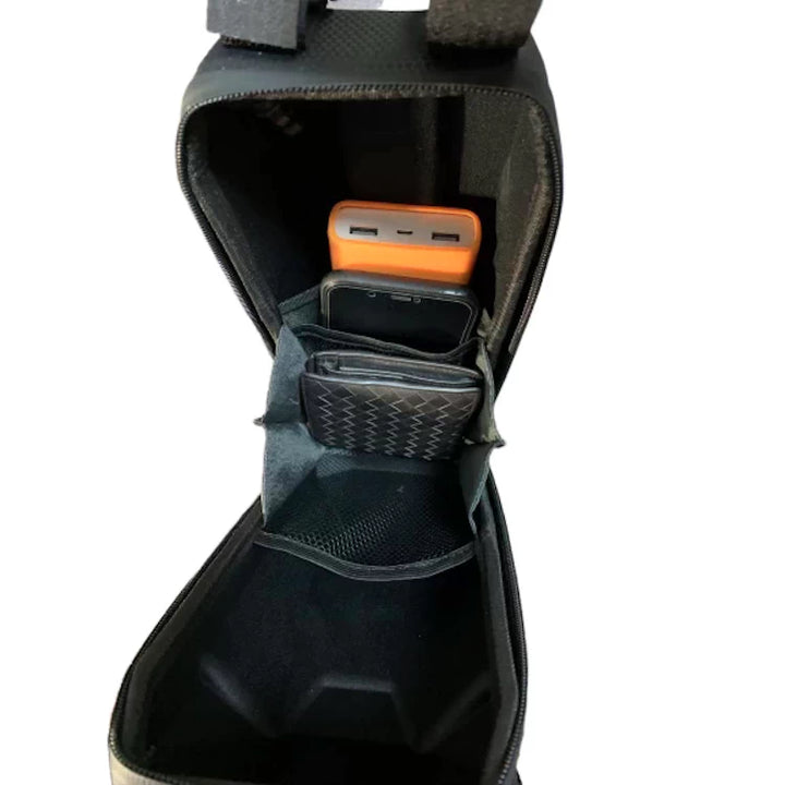 Wallet, phone, charger and keys stored neatly inside the 3-litre EVA pouch, demonstrating its spacious interior for scooter riders.