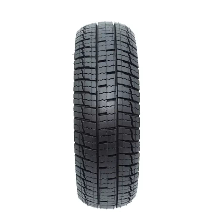Close-up of tread pattern on Ninebot self-healing tyre showing deep urban grooves.
