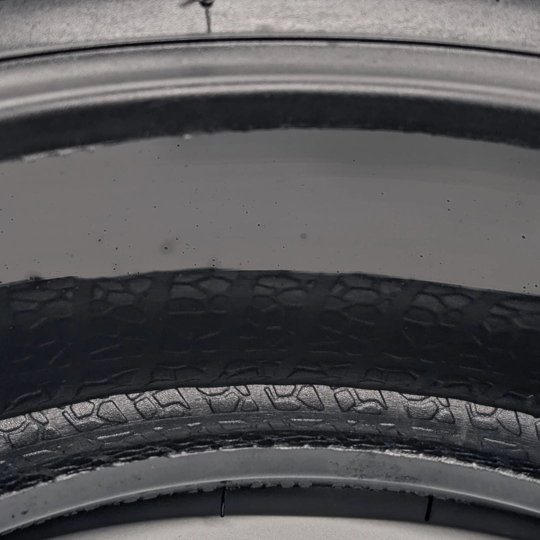 extreme close-up view of the puncture resistant gel layer of the Xuancheng 100/55-6.5 self-healing tubeless tyre.