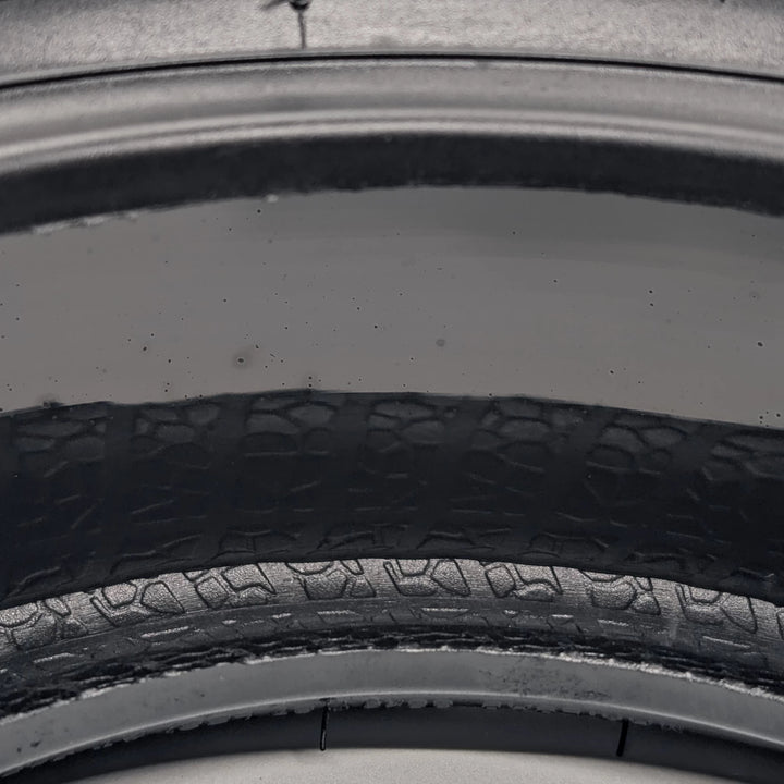 extreme close-up view of the puncture resistant gel layer of the Xuancheng 100/55-6.5 self-healing tubeless tyre.