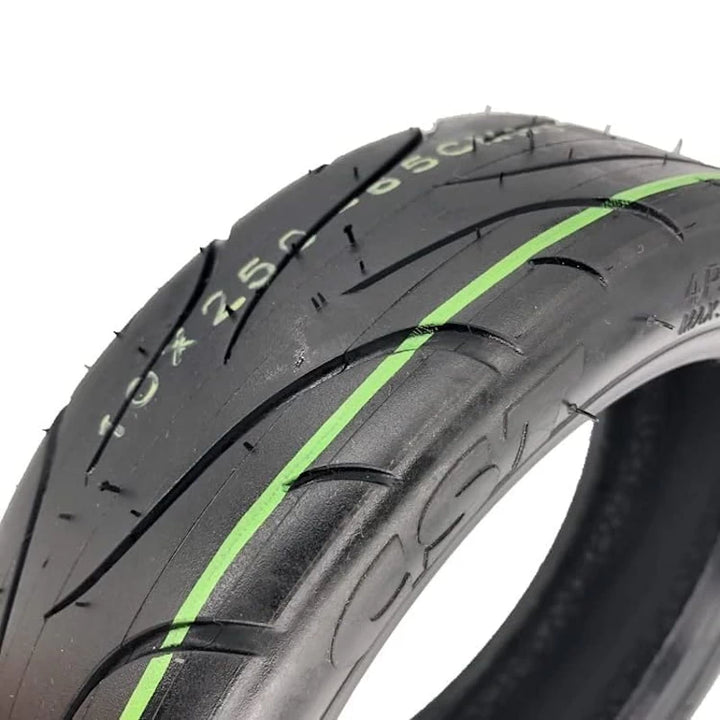 Quarter angle view of the CST 10x2.50-6.5 Tubeless Tyre, highlighting the tread and construction.