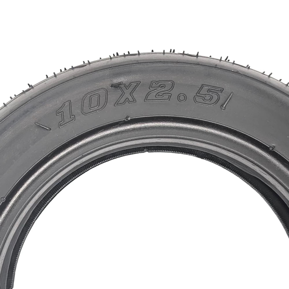 Close-up of embossed 10x2.5 size marking on tyre wall.