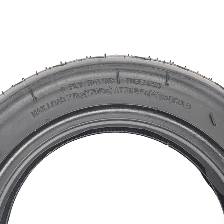 Detail showing “Tubeless” and “4-Ply Rating” sidewall text.