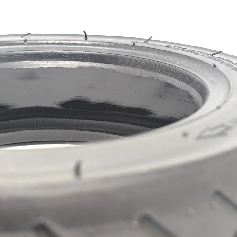 Inner surface showing glossy puncture-seal compound.