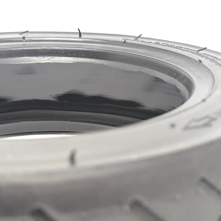 Inner surface showing glossy puncture-seal compound.