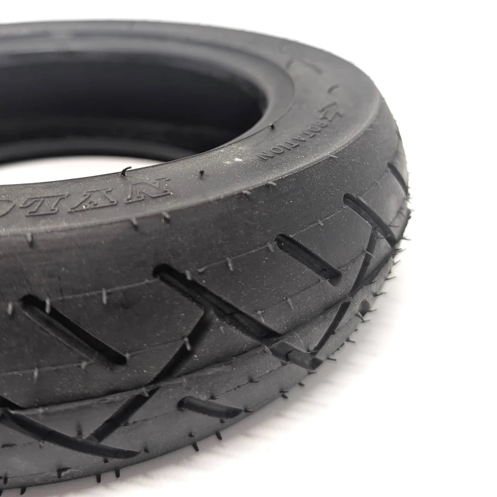 Close tread detail showing cross-pattern grooves and durable rubber surface.