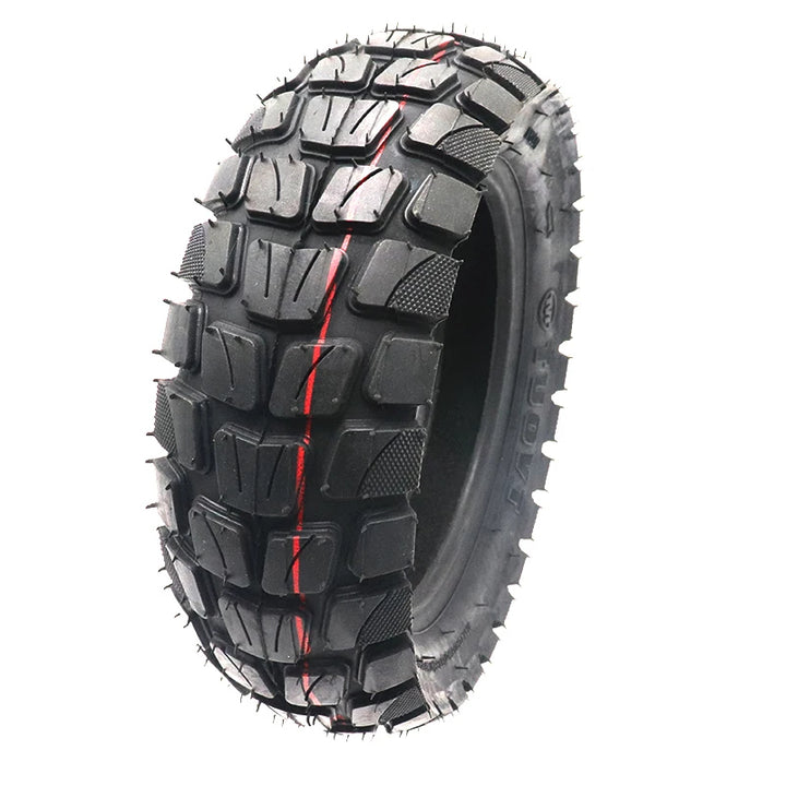 TUOVT 255x80 all-terrain tyre for electric scooters, providing superior traction and durability on diverse surfaces for enhanced off-road performance. A front on view, slightly off centre, shows both the tread pattern and side wall of the tyre..