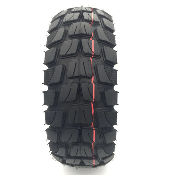 TUOVT 255x80 all-terrain tyre for electric scooters, providing superior traction and durability on diverse surfaces for enhanced off-road performance. A front on view of the tread pattern is shown.