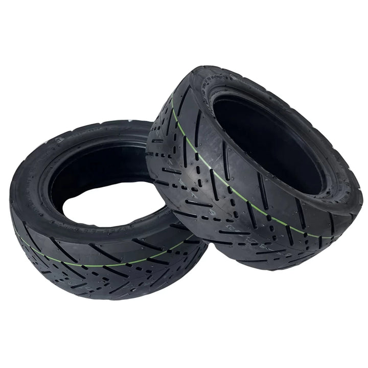 Two 11-inch (90/65-6.5) tubeless road tyres for electric scooters by CST/Tuovt, featuring a durable tread pattern for optimal grip and smooth rides, suitable for NAMI, Dualtron, Kaabo, and Kugoo scooters.