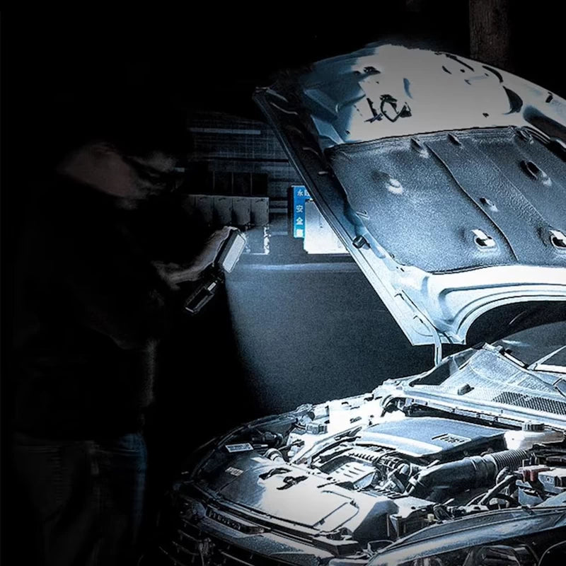 Work light in action, illuminating an engine bay for car repairs, demonstrating its bright LED torch mode.