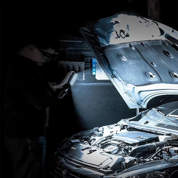 Work light in action, illuminating an engine bay for car repairs, demonstrating its bright LED torch mode.