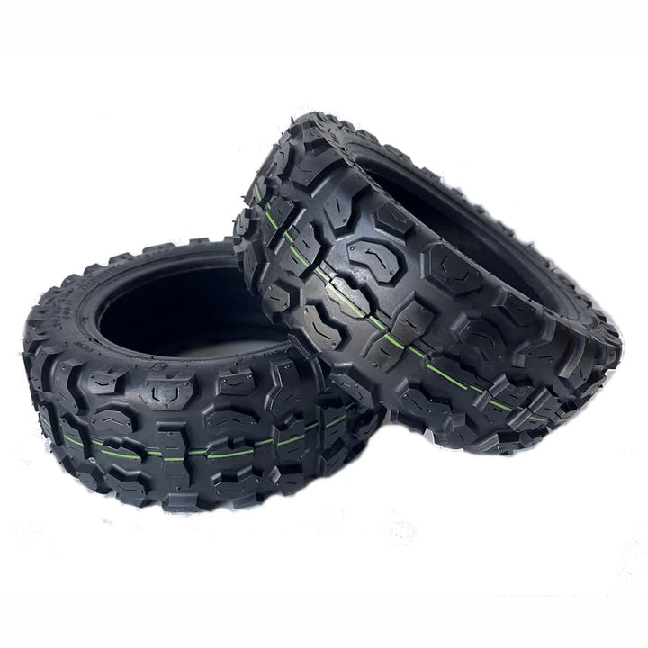Pair of 11 inch CST 90/65-6.5 off-road tyres for electric scooters, featuring aggressive tread for enhanced grip on rough surfaces, compatible with NAMI Burn-E, Dualtron, Kaabo, Kugoo and other scooters.