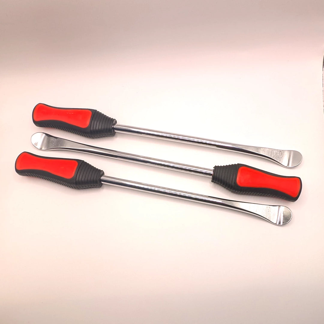 Three metal tyre levers laid in alternating directions, showing spoon-shaped ends and textured handles