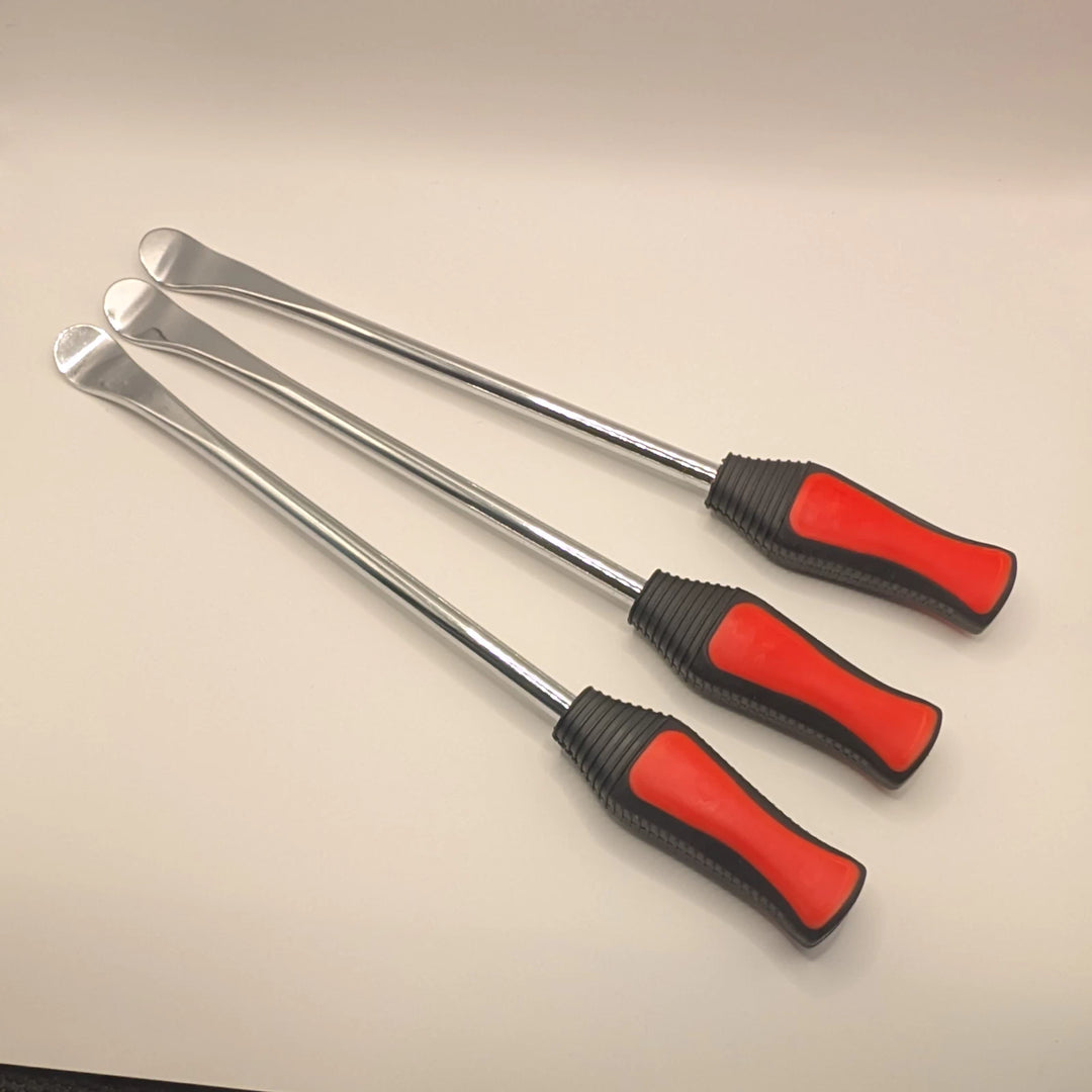 Angled view of three metal tyre levers with long silver shafts and textured red and black handles