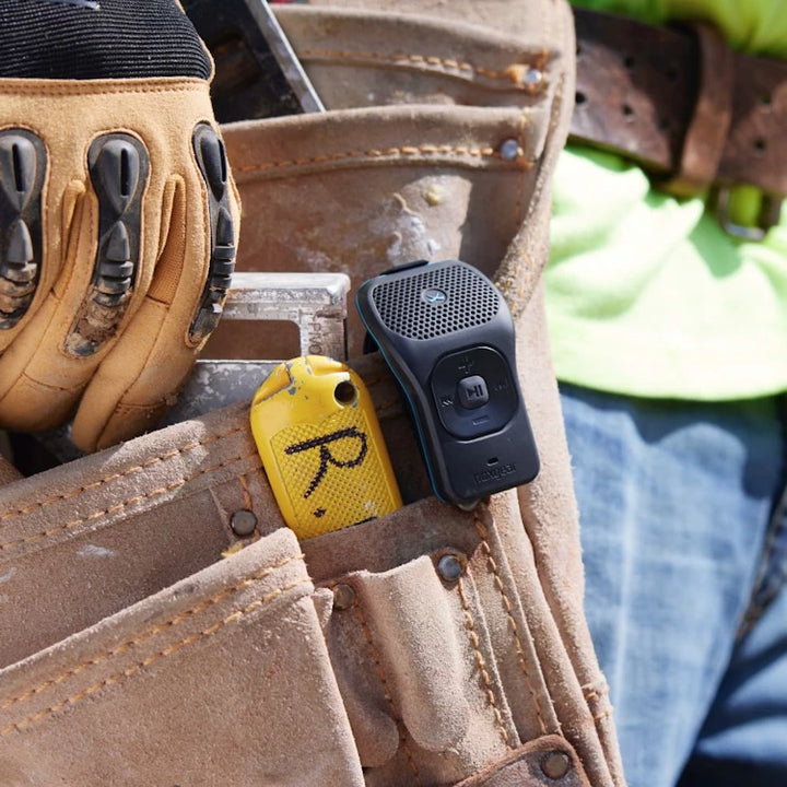 NoxGear 39g Bluetooth speaker clipped to a tool belt, ideal for job sites and hands-free audio.