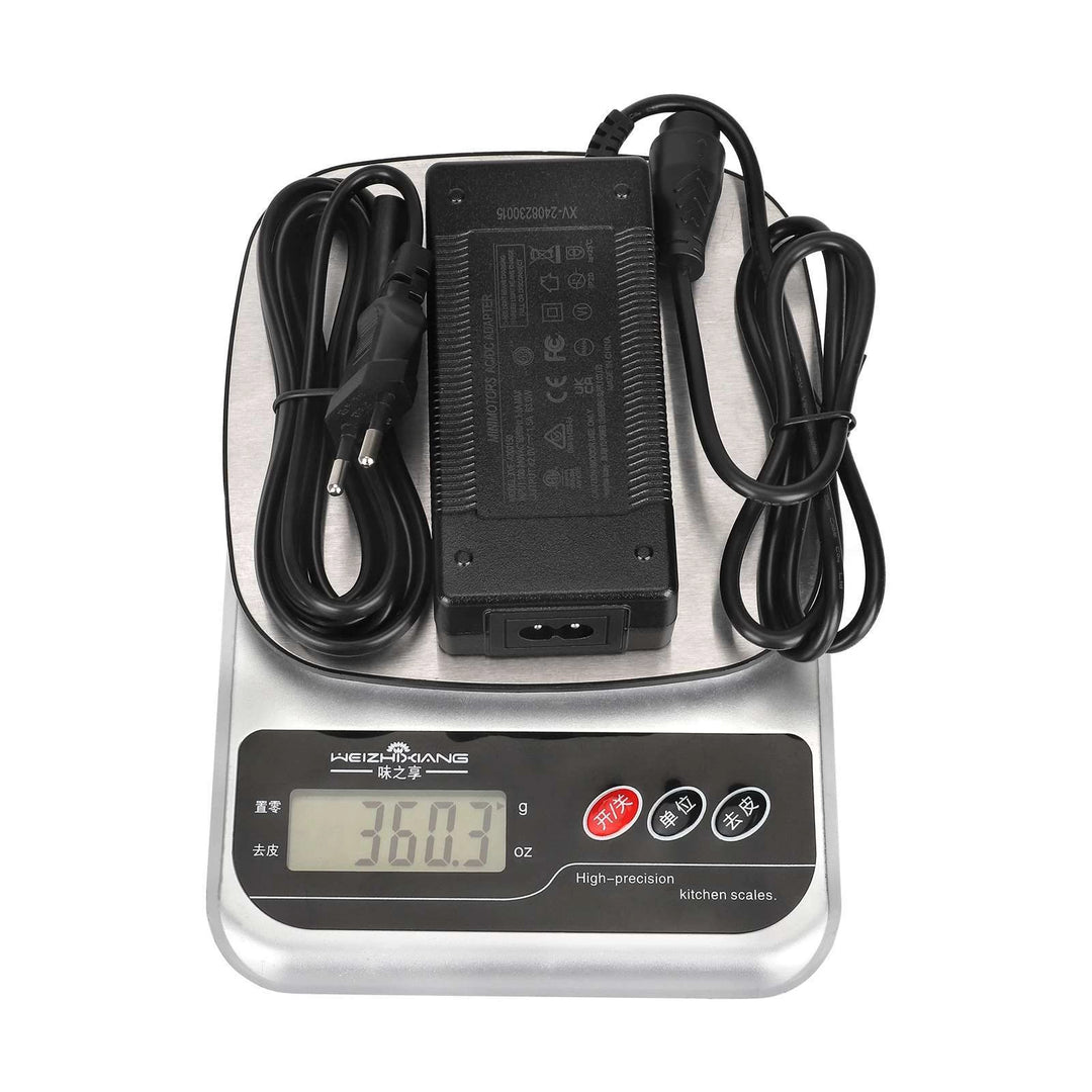 Original Minimotors 42V 1.5A charger for Dualtron TOGO shown on scales weighing approximately 360g.