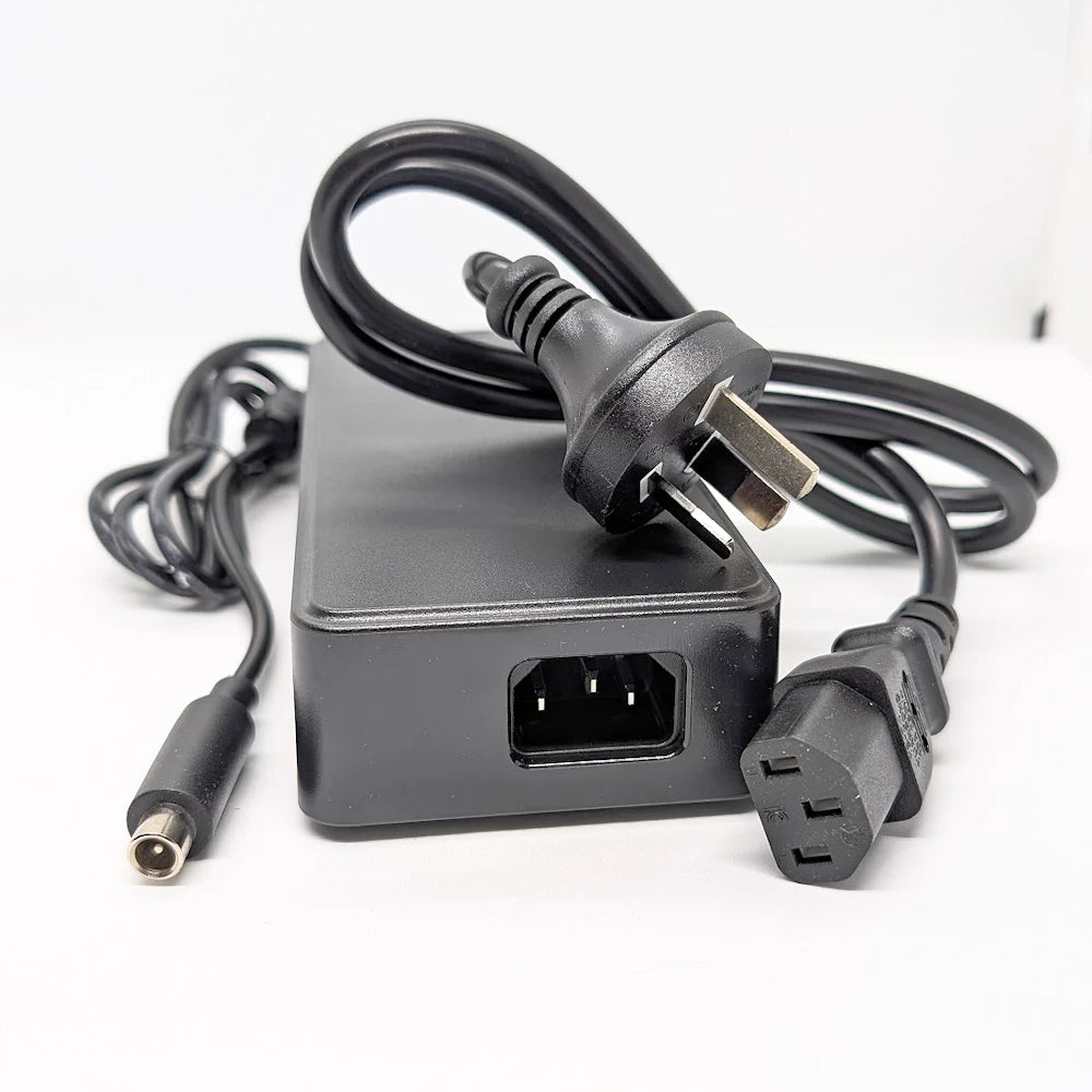 Close-up of IEC320-C14 input socket for power cord connection.