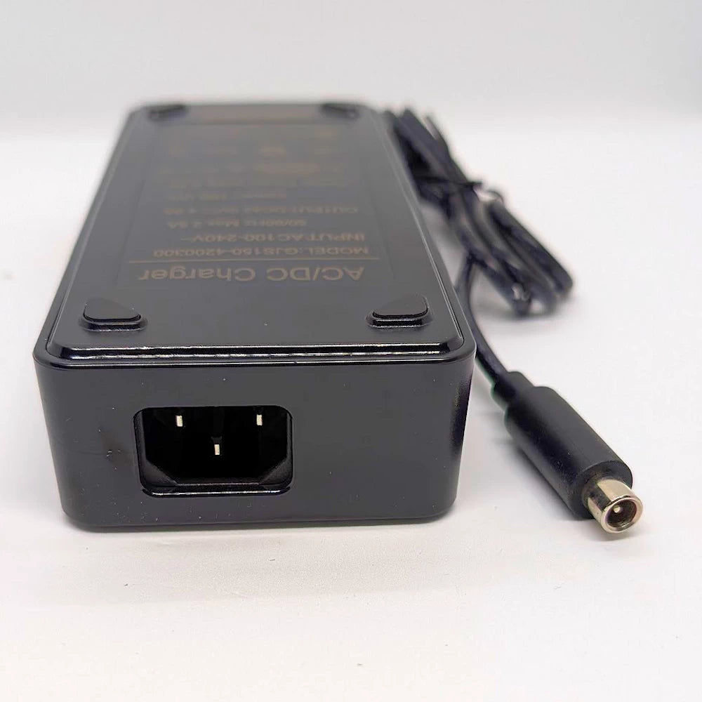 Underside view of fast charger showing power input socket and output plug for Xiaomi & Ninebot.