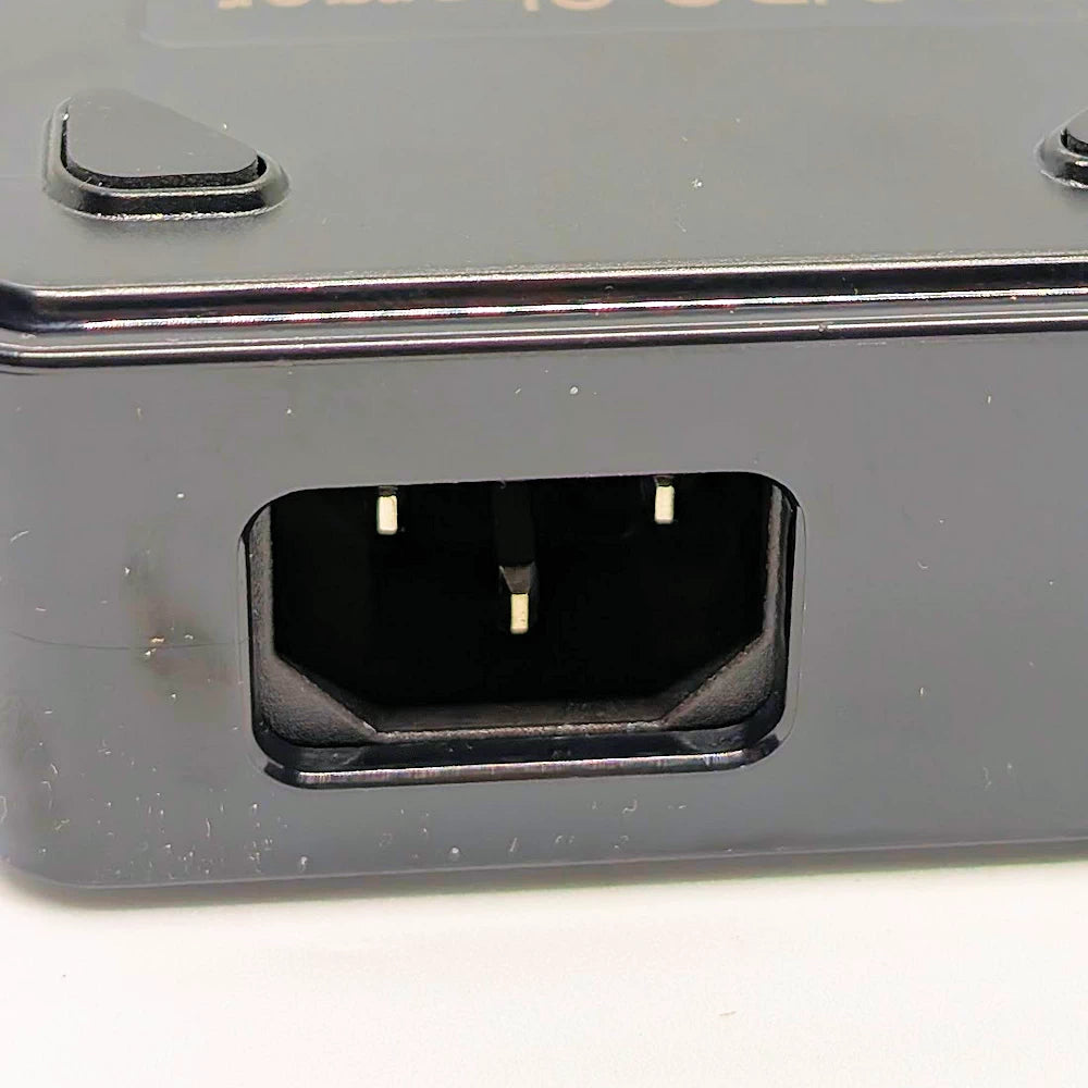 Detail of C14 power inlet on 42V fast charger housing.