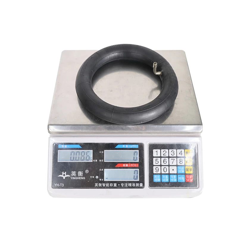 Weight of 70/50-6.1 inner tube displayed on digital scale