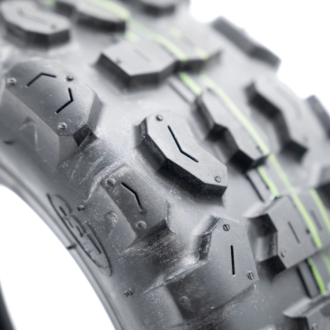 CST 90/65-6.5 electric scooter tyre aggressive off road tread pattern close up