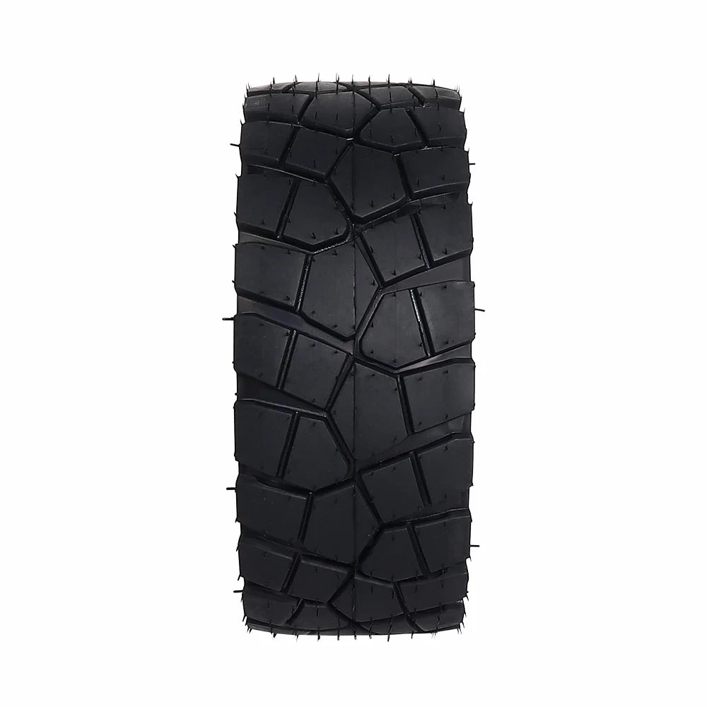 Close-up of all-terrain tread pattern on 9×3.0–5.5 tubeless scooter tyre.