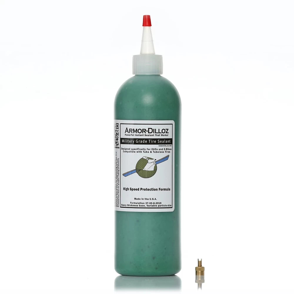 16oz bottle of green (EUC & Bikes) Armor-Dilloz Military Grade Tire Sealant with included valve removal tool, designed for puncture prevention and enhanced durability in electric scooter and bike tyres.