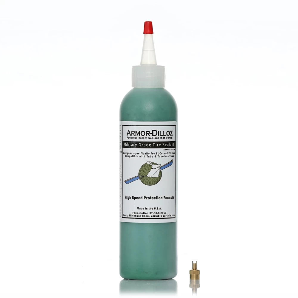 8oz Bottle of green (EUS & Bikes) Armor-Dilloz Military Grade Tyre Sealant with included valve removal tool, designed for puncture prevention and enhanced durability in electric scooter and bike tyres.