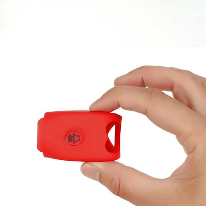 red electric cycling bell with soft silicone body shown compact in hand