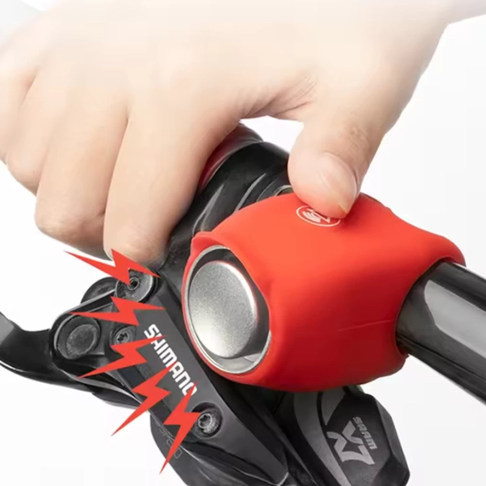 rider pressing red electric horn button on handlebar.