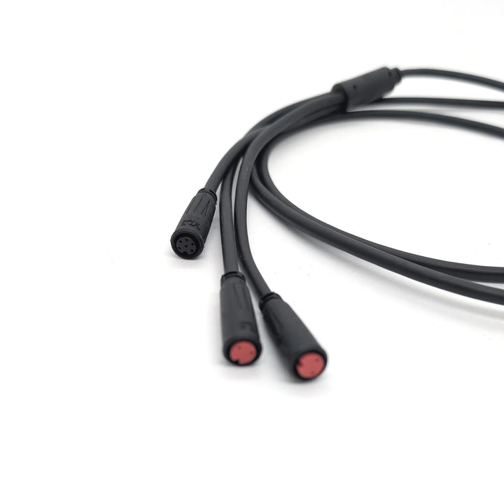 Close-up focus of the black, 6-pin female waterproof plug on the main cable/wiring harness for the Bexly Raven (M9) electric scooter.