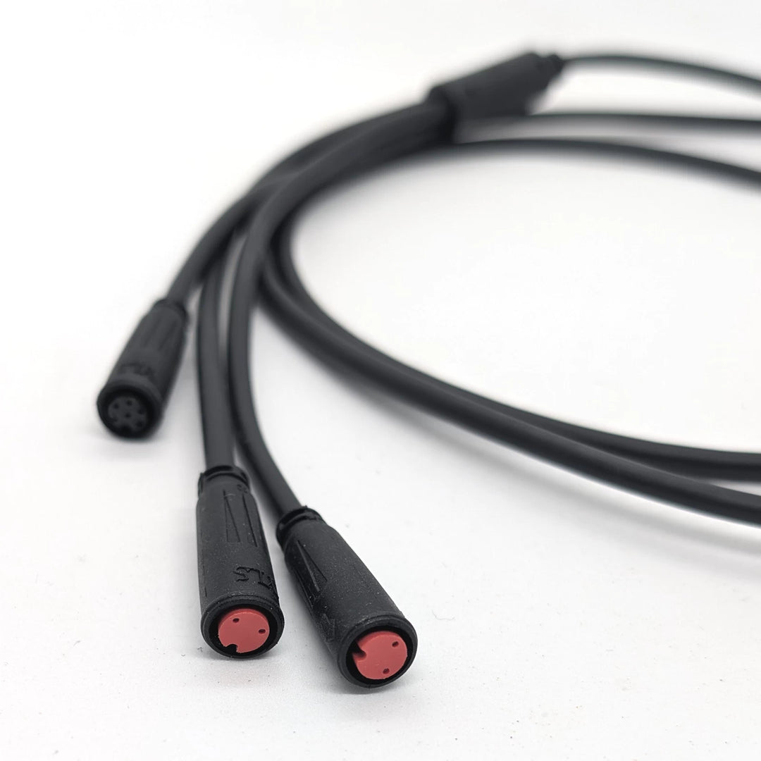 Close-up focus of the two, red-2-pin female waterproof plugs on the 3-to-1 replacement cable/wiring harness for the Bexly Raven electric scooter.
