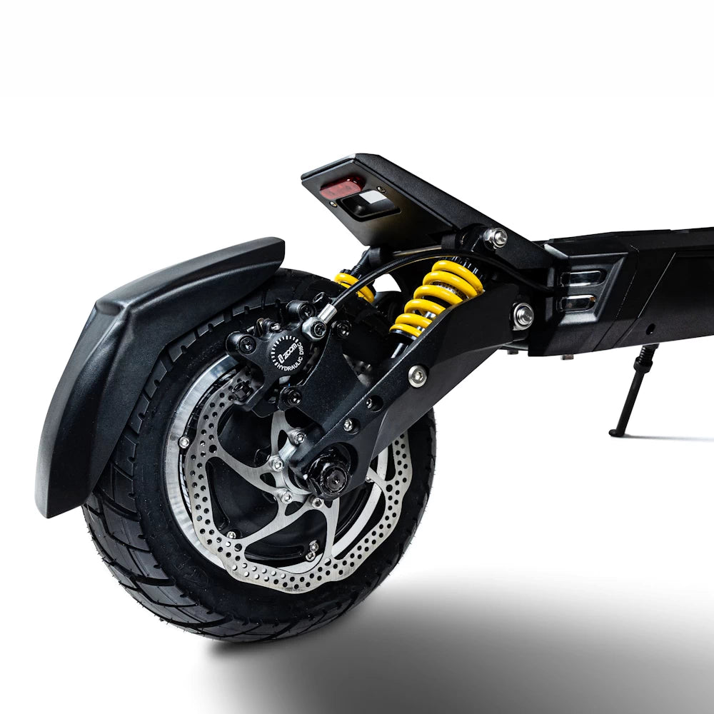 Close-up of rear disc brakes and suspension on Bexly Blackhawk Pro, showcasing advanced hydraulic braking system and dual spring shock absorbers for safety and comfort.