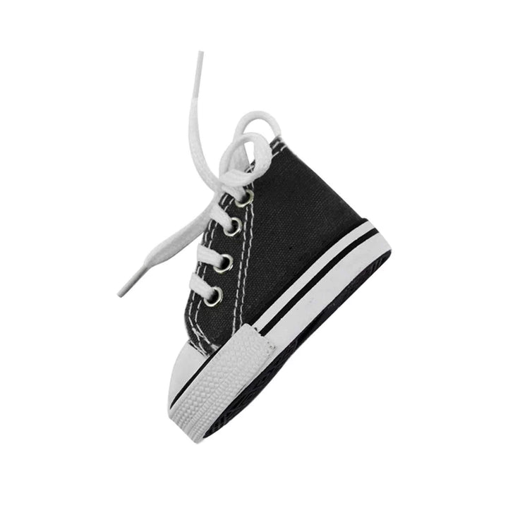 Side view of a black and white canvas sneaker-style cover for kickstands