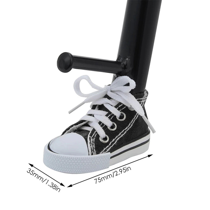 Close-up of a black sneaker-shaped kickstand cover fitted on a bike with dimensions of 75mm x 35mm.